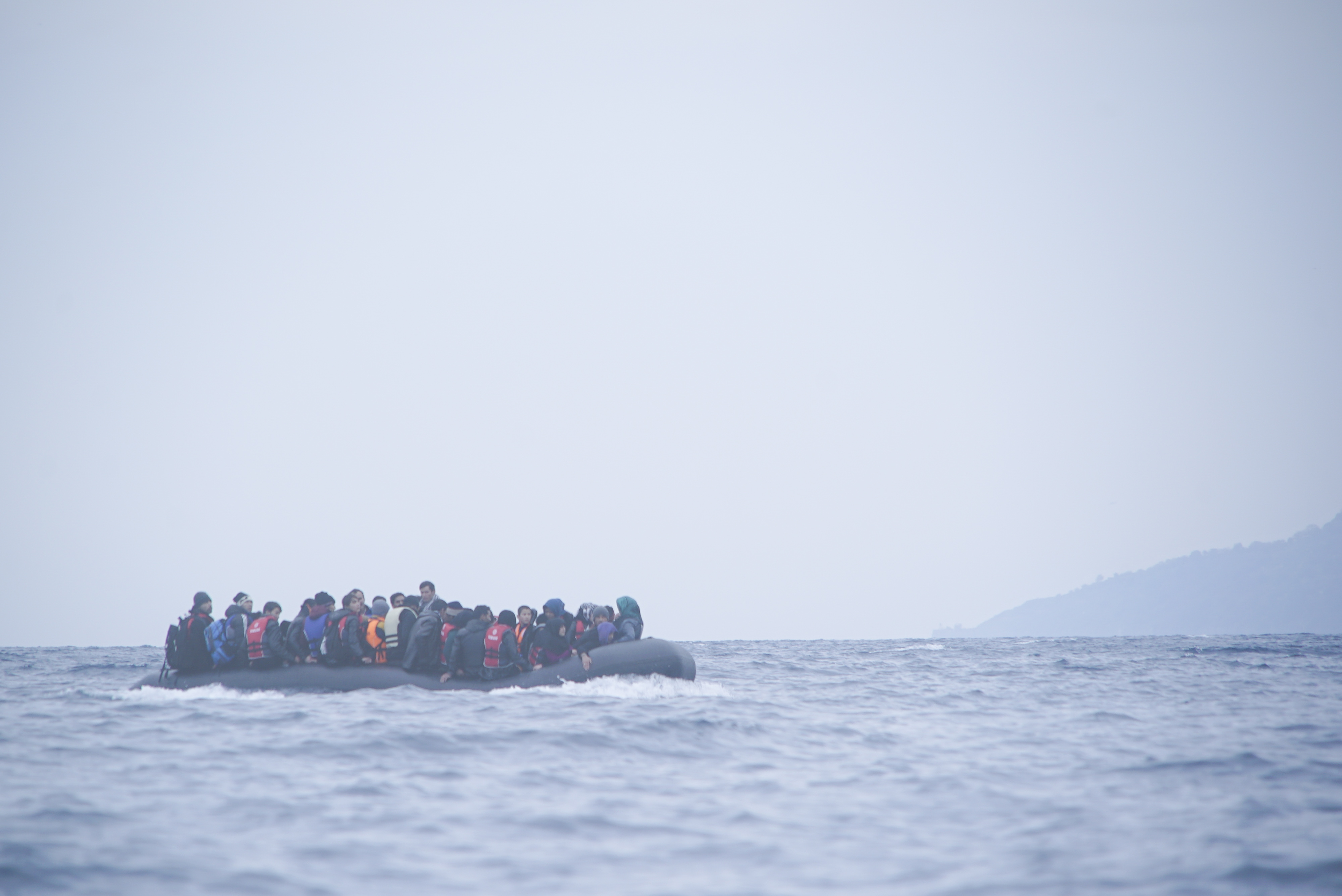 Refugees on a boat crossing the Mediterranean sea, heading from Turkish coast to the northeastern Greek island of Lesbos,  29 January 2016.